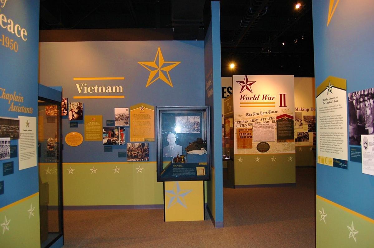 Several museum exhibit wall in a room inside the US Army Chaplain Corps Museum.